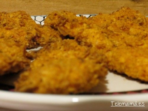 Detalle. Pollo empanado con doritos.